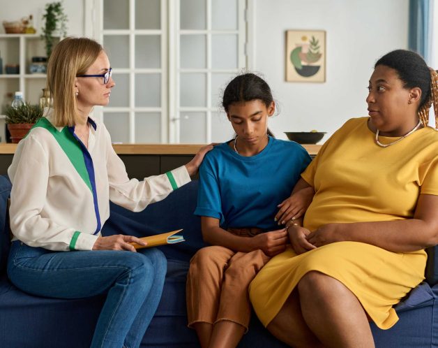 psychologist-having-conversation-with-family-2023-12-15-00-20-36-utc (1)